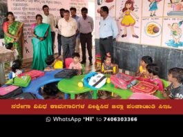 A group of children sitting in an Anganawadi Center playing